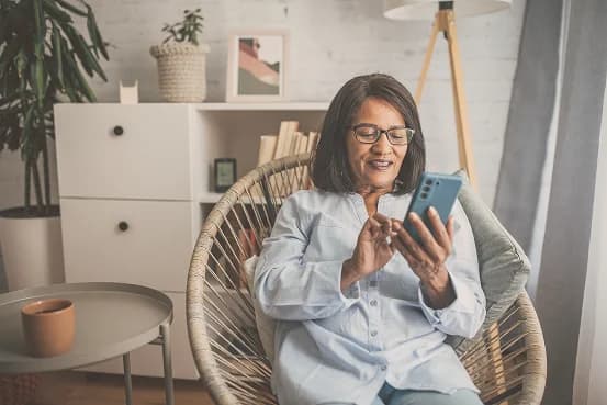 Family caregiver checking a phone update
